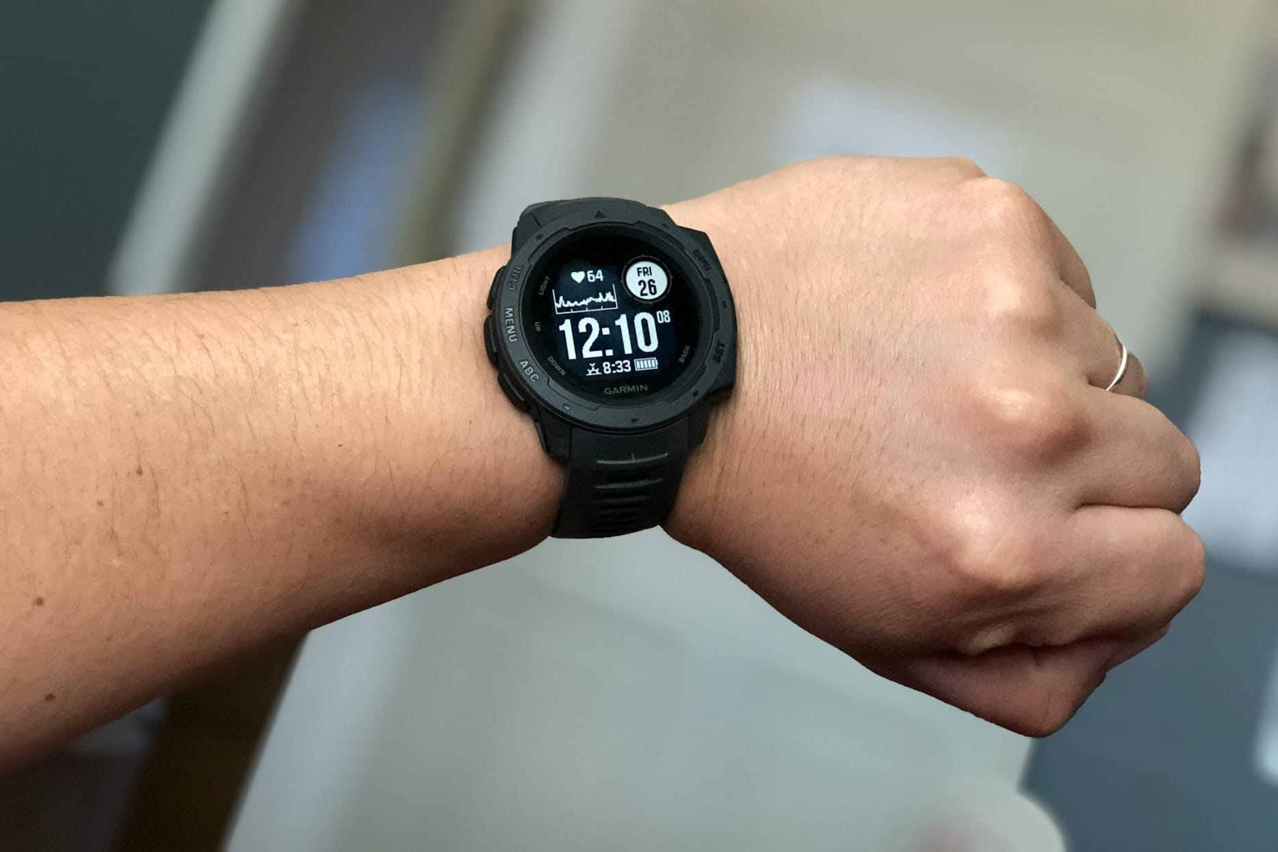 person wearing black digital watch